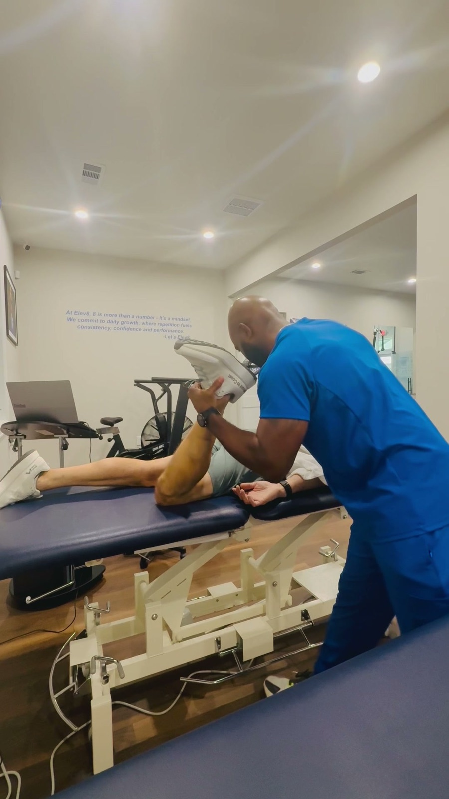 Dr. Kenneth Nwosu delivering one-on-one care at Elev8 Physical Therapy & Performance